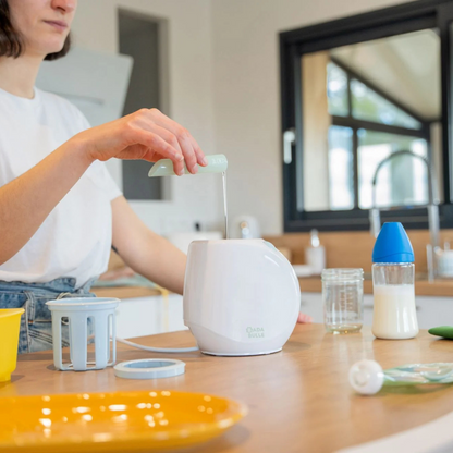Badabulle – Incalzitor de biberoane/borcane pentru casa si masina Easy+ Pastel